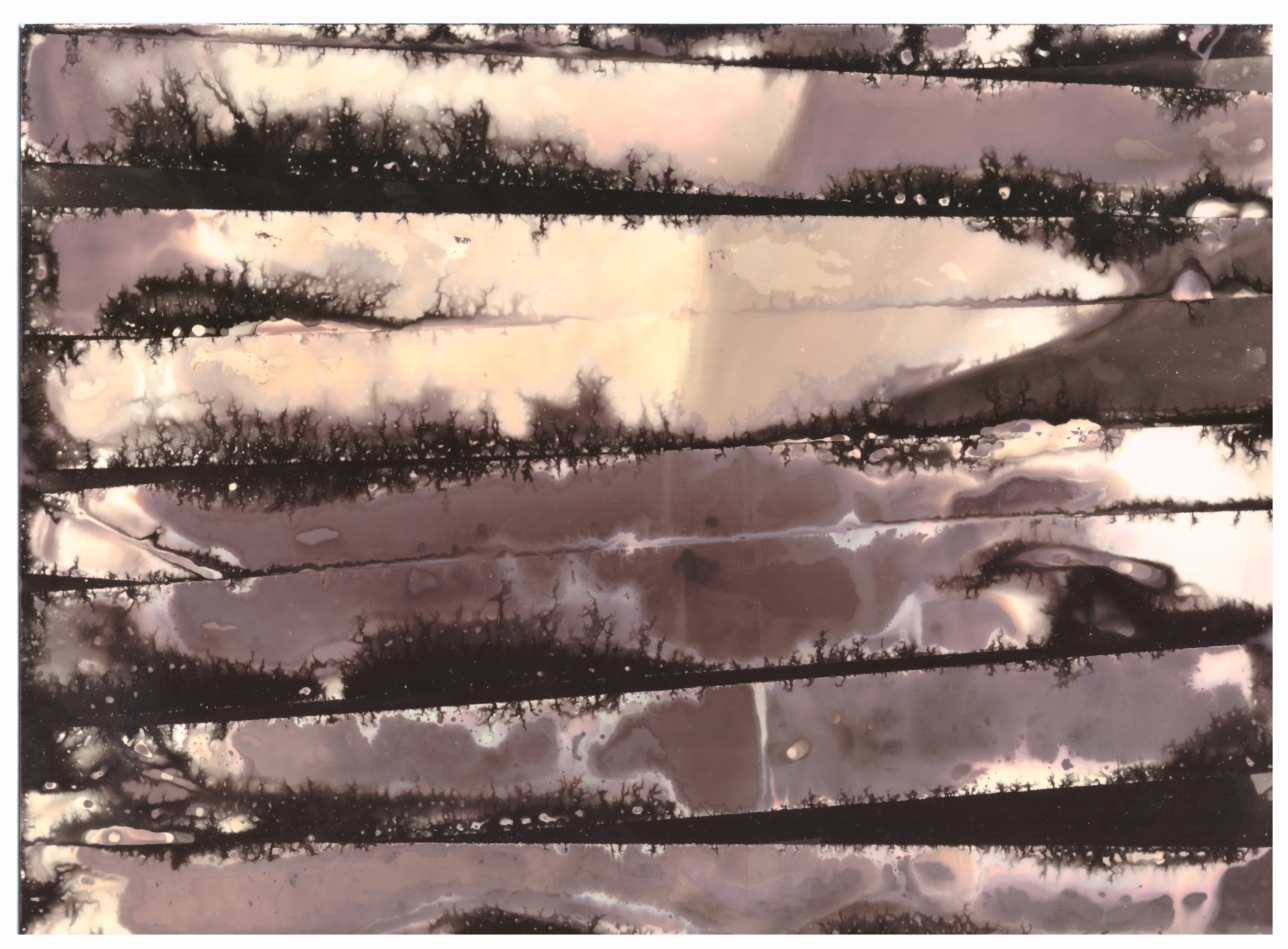 Horizontal dark bands bleeding across a pale surface